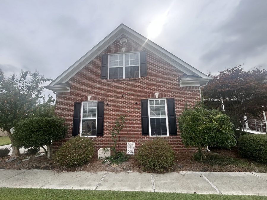 brick home exterior with black painted shutters Preview Image 2