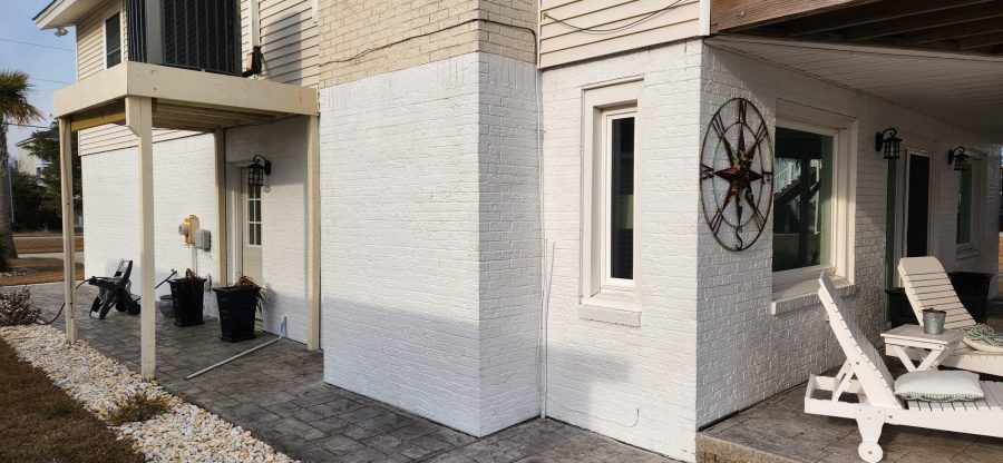 repainted white brick house exterior