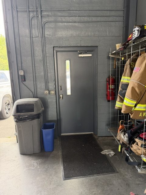 dark grey painted commercial facility door and surrounding wall Preview Image 5