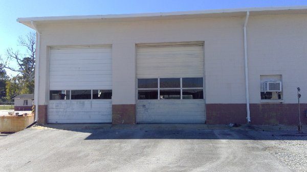 auto service shop exterior and bay doors before repaint Preview Image 15