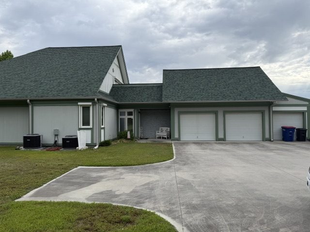 home exterior painted light sage green with darker green trim and accent areas Preview Image 4