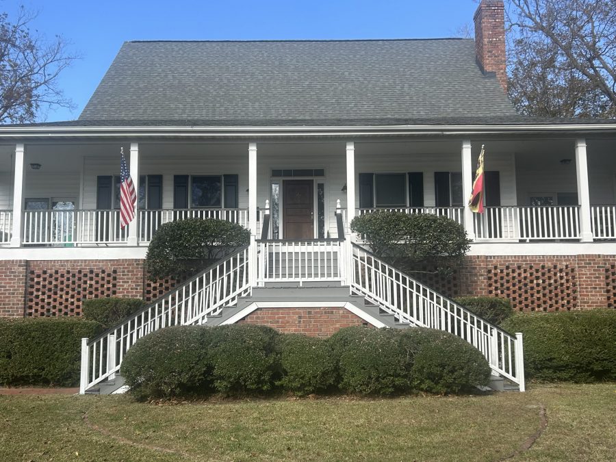 front exterior of house with porch and double staircase