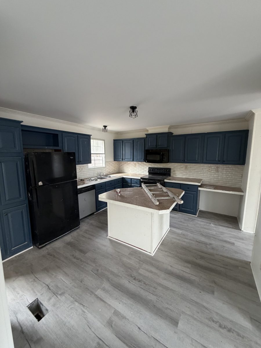 repainted kitchen with navy cabinets
