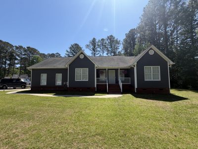 house exterior with painted dark siding