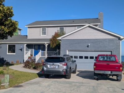 painted brick coastal home exterior