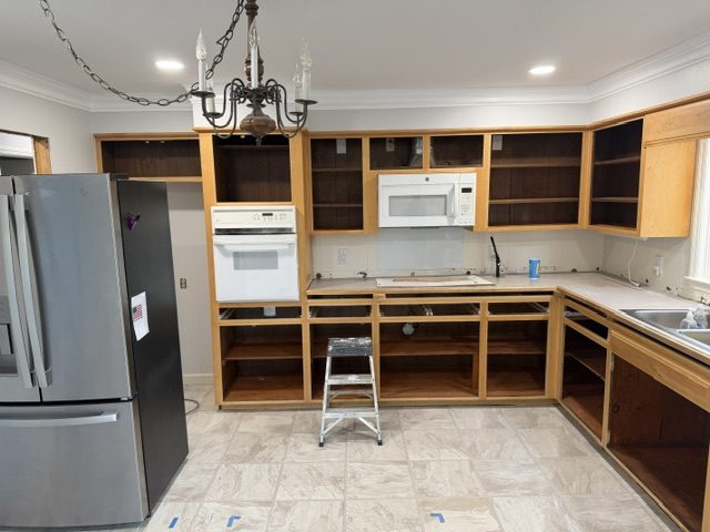 home kitchen with cabinet doors removed before repaint Preview Image 4