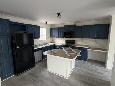 repainted kitchen with navy cabinets