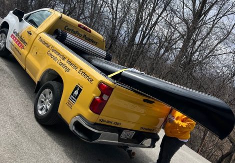 canoe in back of CertaPro truck