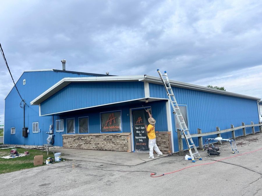 blue painted car wash building with painter and ladder Preview Image 1
