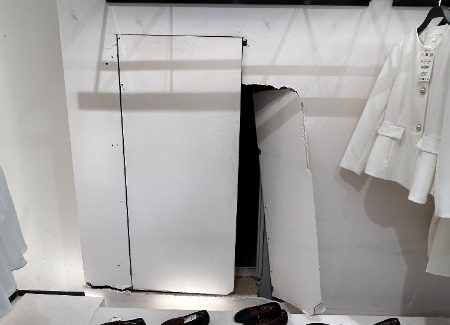 retail store display with water damaged drywall cut out