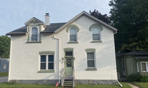 White Brick Exterior w/ Green Trim