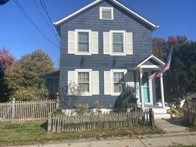 blue house painting white shutters