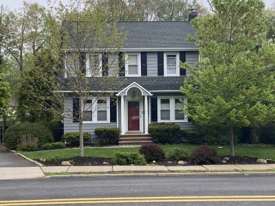 gray and white exterior red front door