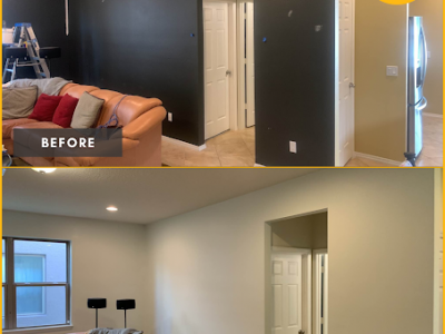 before and after of living room wall painting from black to white