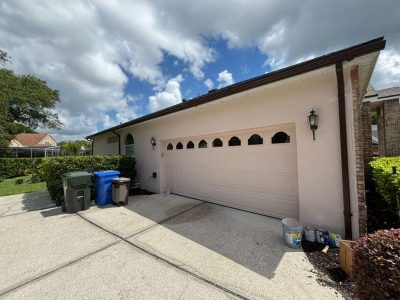 painted stucco exterior and garage door of house