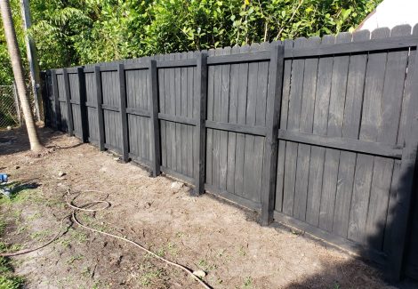 Backyard Wooden Fence Stained and Painted