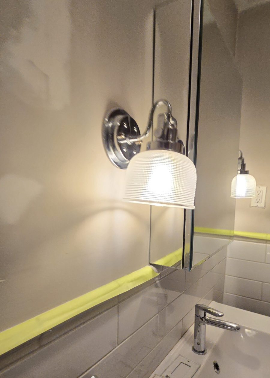 bathroom wall and sconce during repaint Preview Image 7