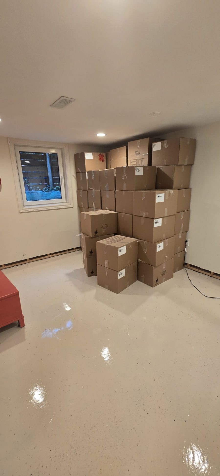 cardboard boxes stacked in corner of room Preview Image 9