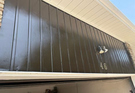 brown painted garage door and siding
