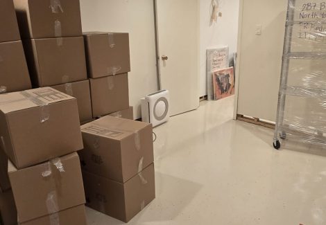 cardboard boxes stacked in corner of room