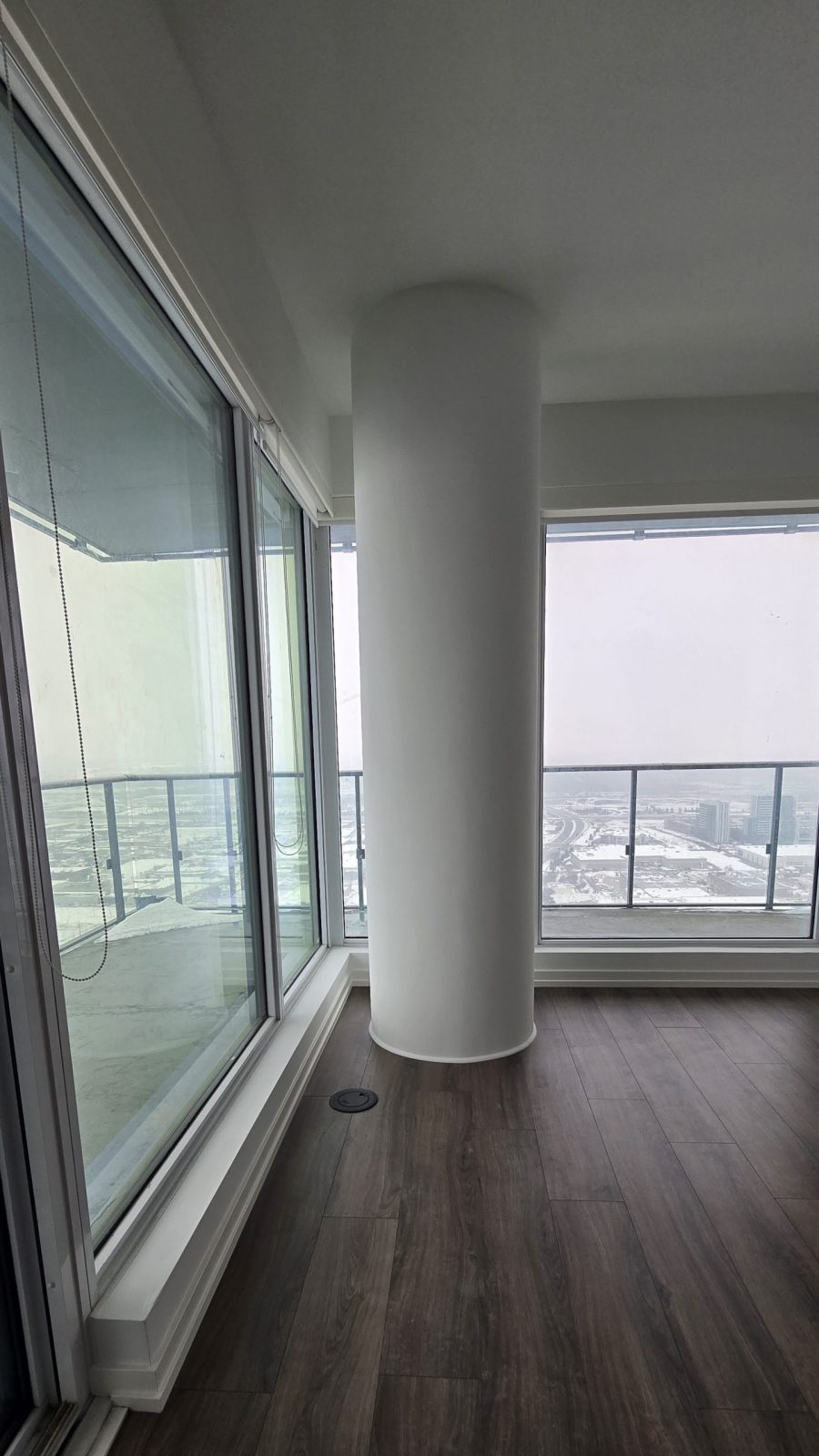 column and floor to ceiling windows in condo