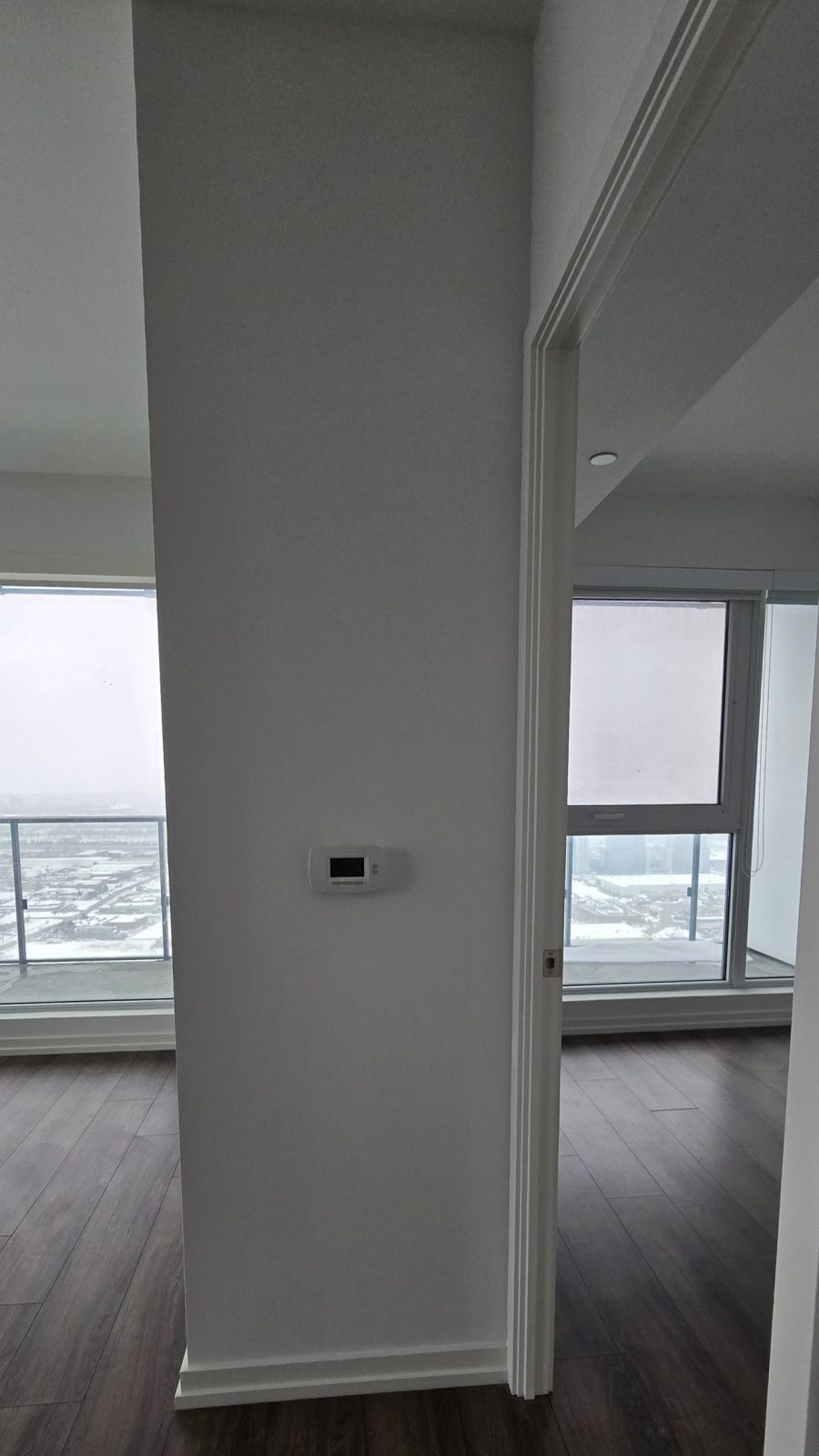 column and floor to ceiling windows in condo Preview Image 1