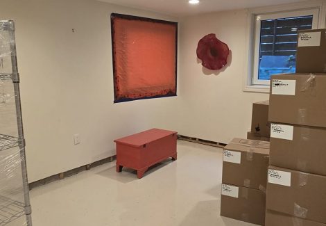finished basement room with stacked boxes