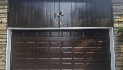 brown painted garage door and siding