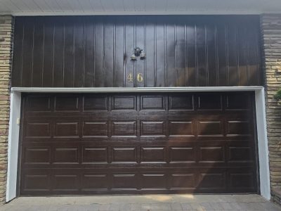 brown painted garage door and siding