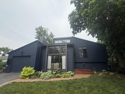 front of house with dark blue painted siding