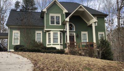 home with green painted exterior