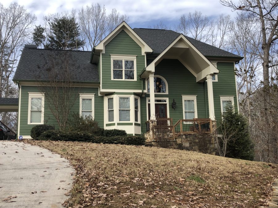 home with green painted exterior