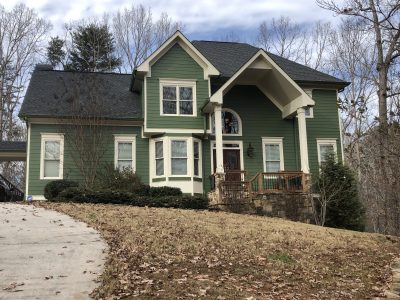 home with green painted exterior