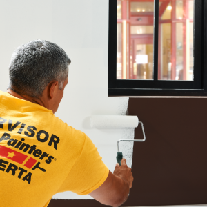 certapro painter painting a commercial storefront