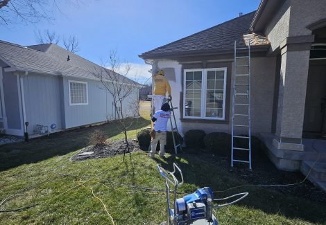 Spraying and Backrolling Stucco Home