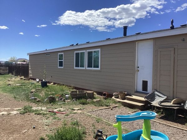 house with beige siding before repaint Preview Image 6