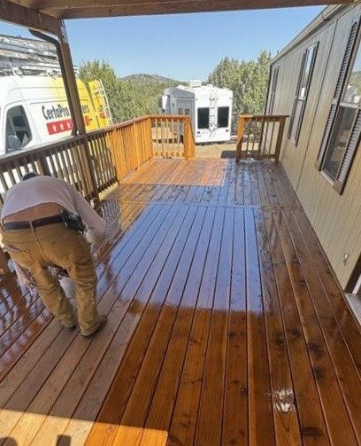 painter staining wooden deck Preview Image 5