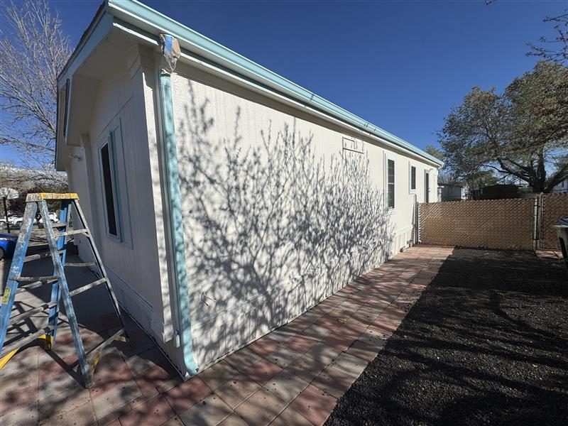white house exterior with blue trim and roof Preview Image 1