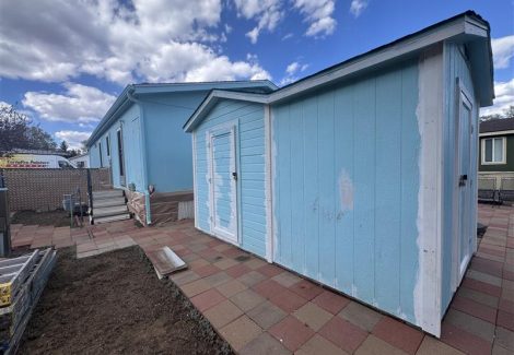 house exterior with blue siding and white repaint