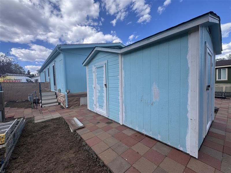 house exterior with blue siding and white repaint Preview Image 5
