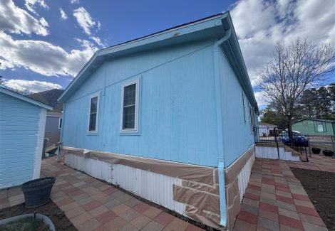 house exterior with blue siding and white repaint