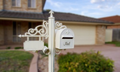 White mailbox in front of house
