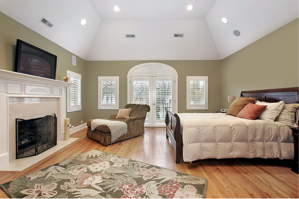 Master Bedroom painted a natural shade with a white vaulted ceiling.