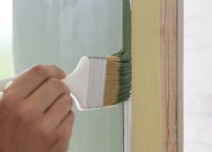 hand painting an interior wall