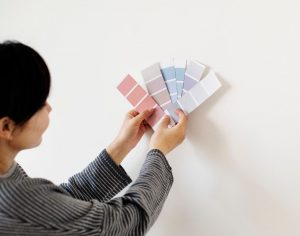 woman comparing paints