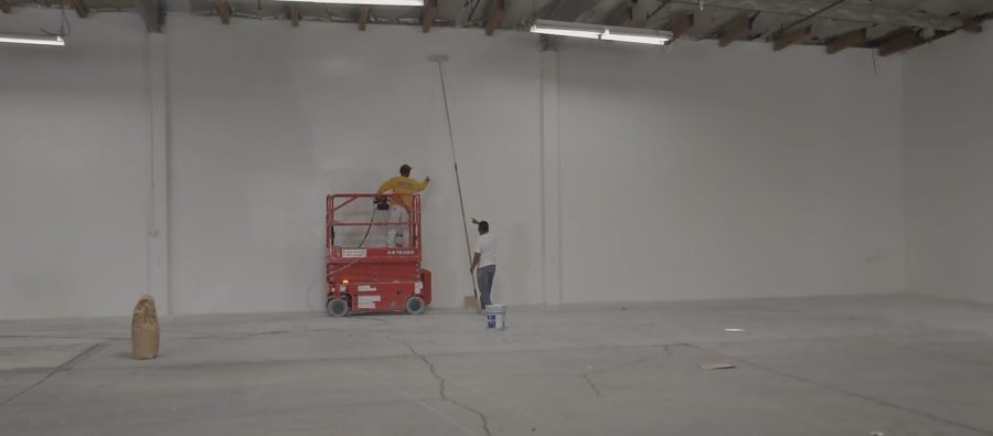 USing a scissor lift to paint a warehouse interior. Preview Image 2