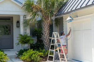 painter in nw Florida painting a home
