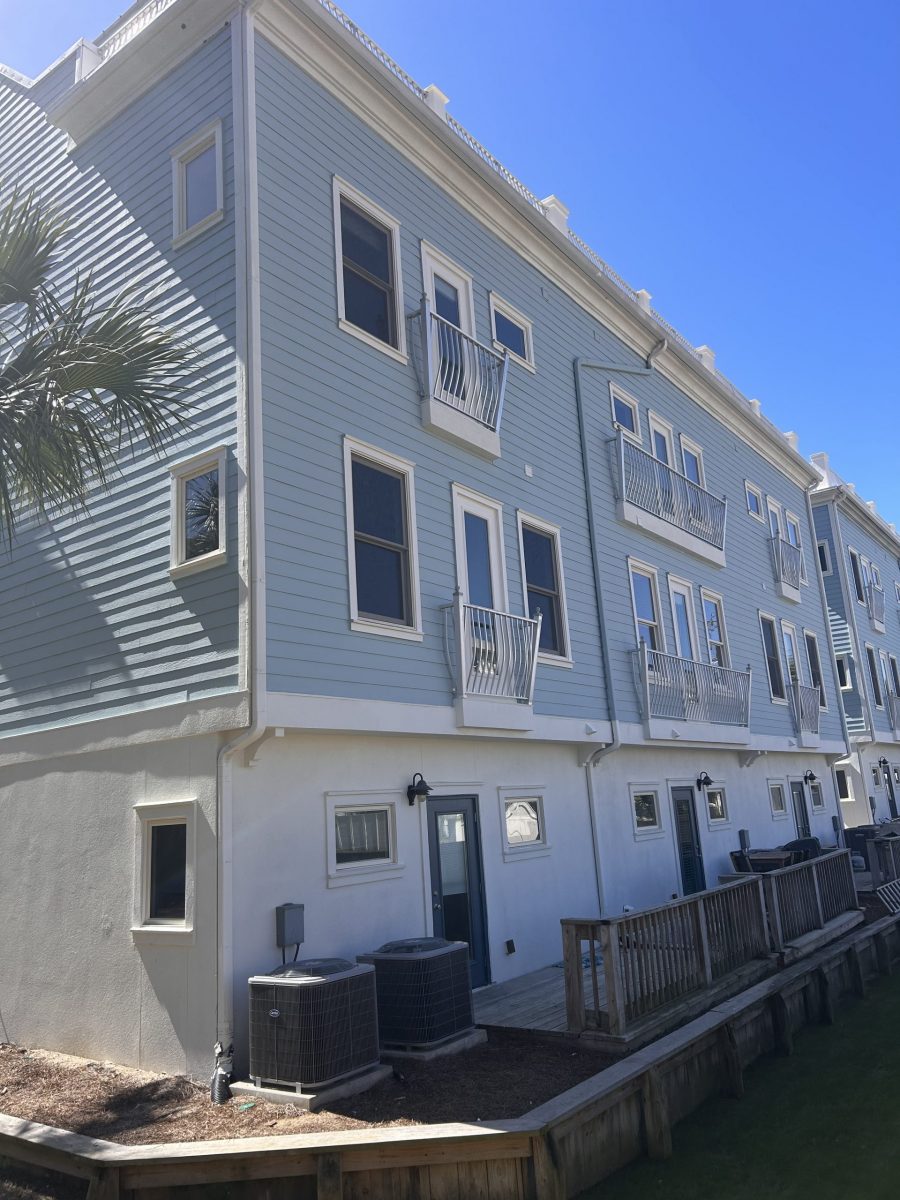 condo building exterior with painted blue siding and white trim and accents Preview Image 2