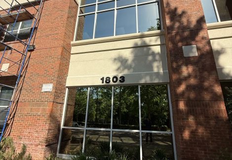 exterior of stucco and brick commercial building