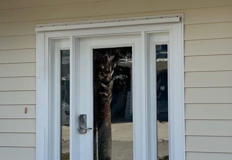 house with beige siding and white door